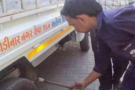 Technician doing free PUC check ups conducted by Tata Motors